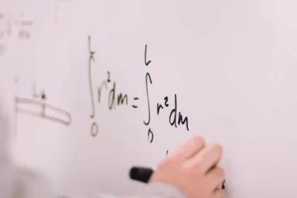 Person Writing On White Board.